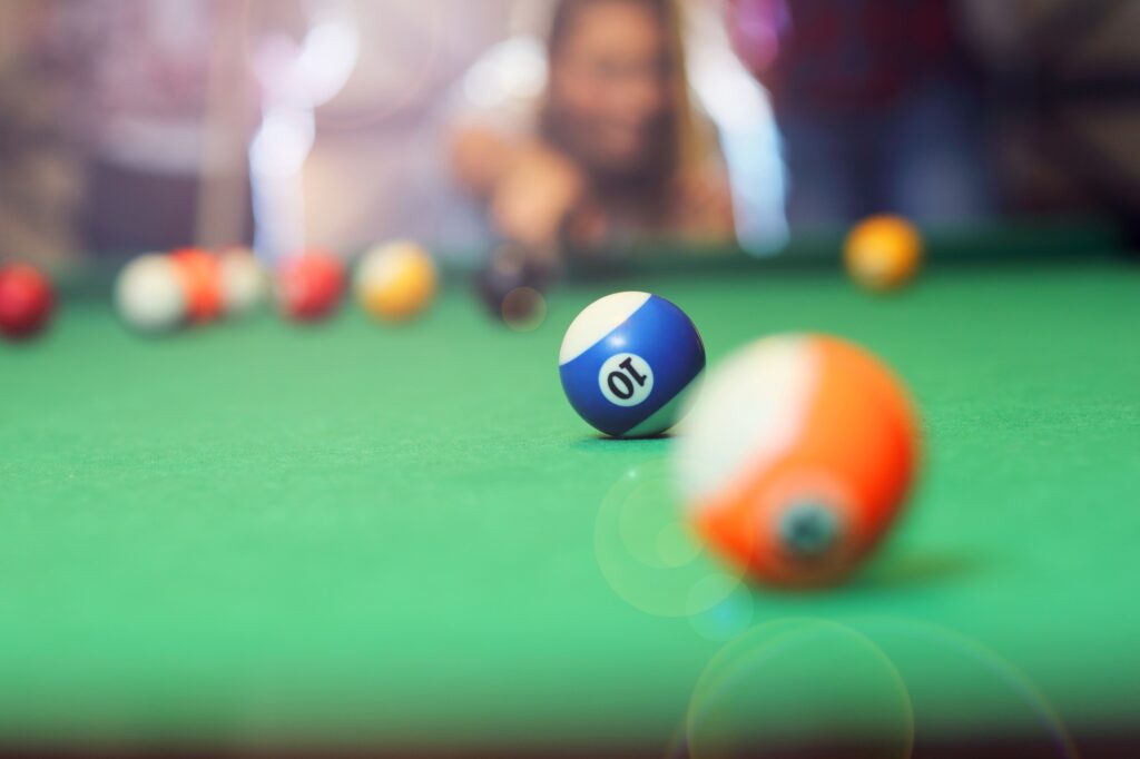 Group of friends playing billards